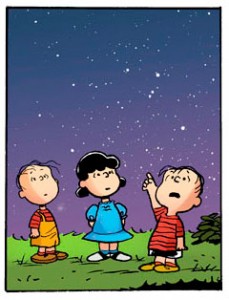 A panel from "Twinkle Thinkle" -- Rerun and Lucy look on as Linus points into the starry night sky.