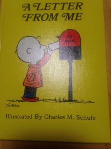 The cover of A Letter From Me: Charlie Brown put mail in a mailbox