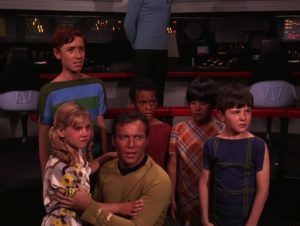 Screen shot from "And the Children Shall Lead" with Pamelyn Ferdin, other kids, and William Shatner on the bridge of the Enterprise