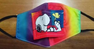 Picture of face mask with image of Snoopy and Woodstock on it.