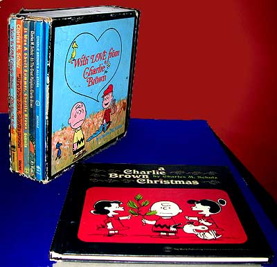 Picture of boxed set of Peanuts books, with a copy of A Charlie Brown Christmas book sitting out.
